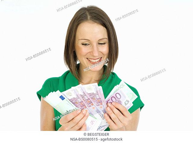 young woman with much money