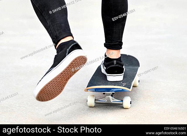 Close up of young man riding a skateboard at the skate park