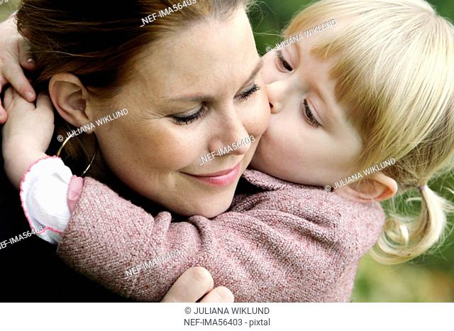 A daughter kissing her mother Sweden