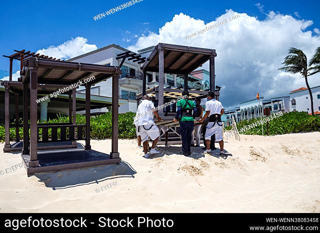 Workers take preventive measures to avoid damage at touristic areas in Playa Del Carmen, Mexico on August 18th 2021 due to the arrival of Hurricane ""Grace""