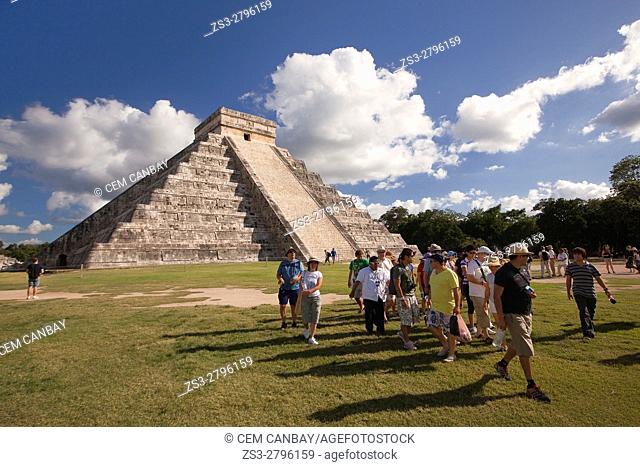 Tourist walking around the Pyramid of Kukulcan-El Castillo, Maya Archeological Site, Chichen Itza, Yucatan Province, Mexico, Central America