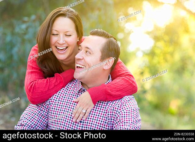 Attractive Happy Caucasian Couple Laughing Outdoors