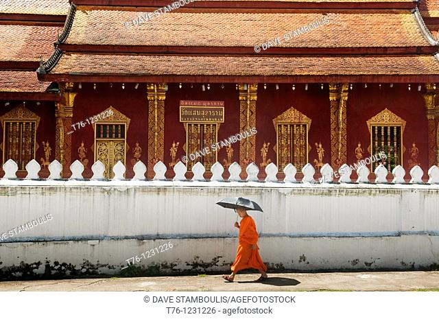monk walking in Luang Prabang in Laos