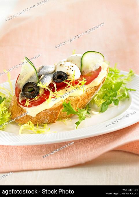 Mediterranean toast, with tomatoes, cucumber, egg and black olives