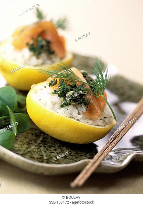 Lemons stuffed with salmon sushis