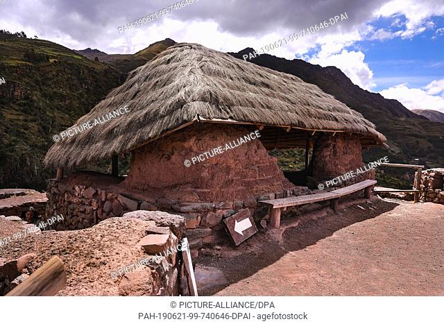 02 May 2019, Peru, Pisac: Straw covered building in the Inca city of Pisac in the Sacred Valley. The complex is located at 3000 meters north of Cusco