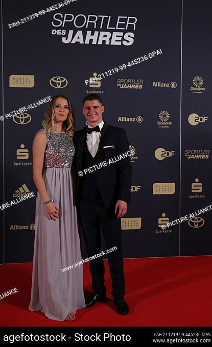 19 December 2021, Baden-Wuerttemberg, Baden-Baden: Lukas Dauser, artistic gymnast, and company arrive at the gala for the election of the ""Sportsman of the...