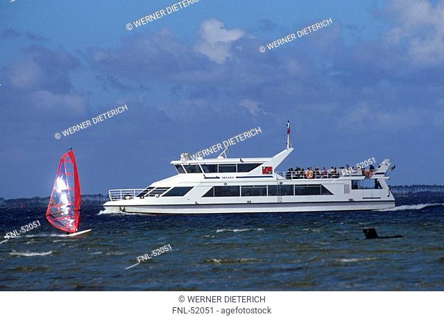 Tourists on ferry in sea, Hiddensee, Rugen, Mecklenburg-Vorpommern, Germany