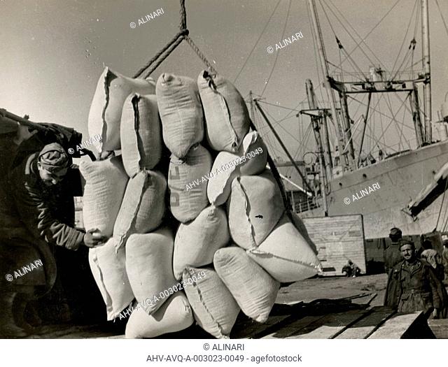 Foodstuffs & Munitions being unloaded in Naples Port from the Italian troops, shot 1944
