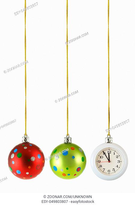 Christmas balls and hanging clock isolated over the white background