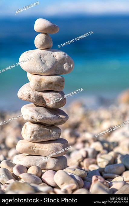 Stack of pebbles on the beach in PotovoÅ¡Ä‡e, Vbrnik, island of Krk, Kvarner Bay, Primorje-Gorski Kotar County, Croatia