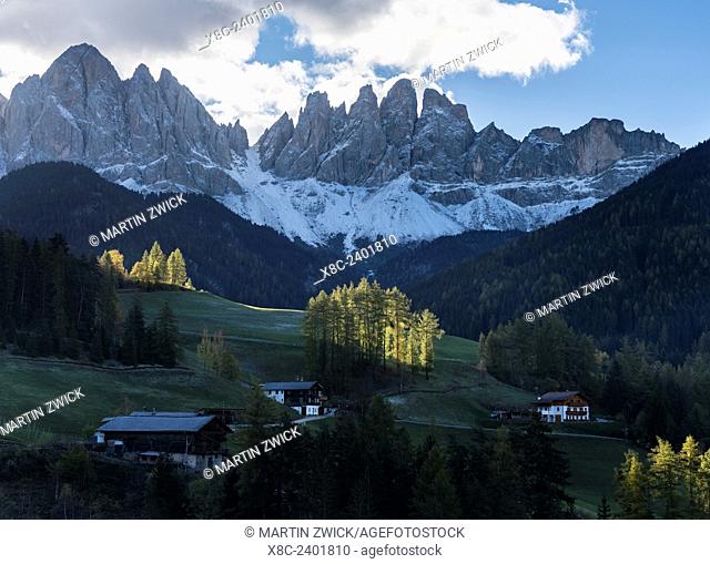The village Sankt Magdalena in the Villnoess valley in the Dolomites during autumn. The peaks of the Geisler Mountain Range (Gruppo delle Odle)