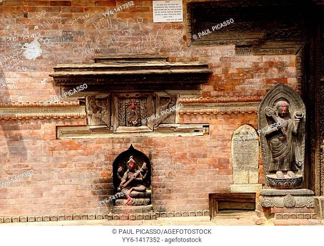 old hindu shrine with statues of hindu gods, back streets of kathmandu, nepal