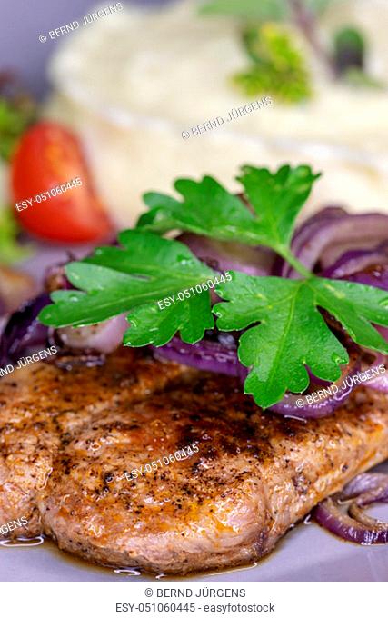 grilled pork steak with onions