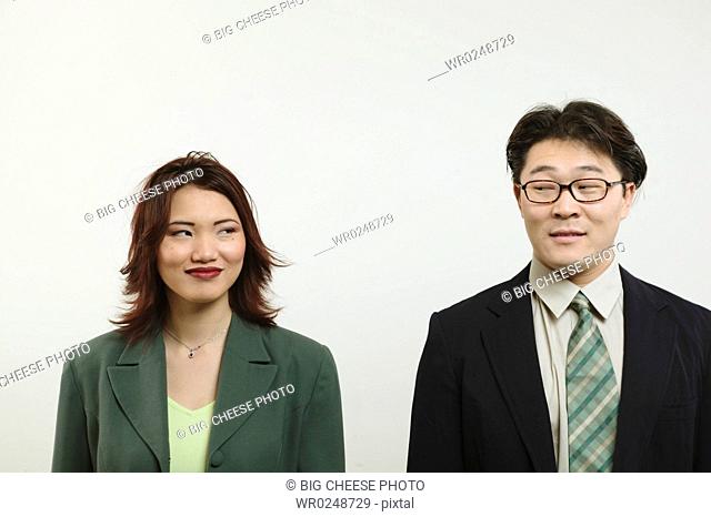 Businessman and woman looking at each other