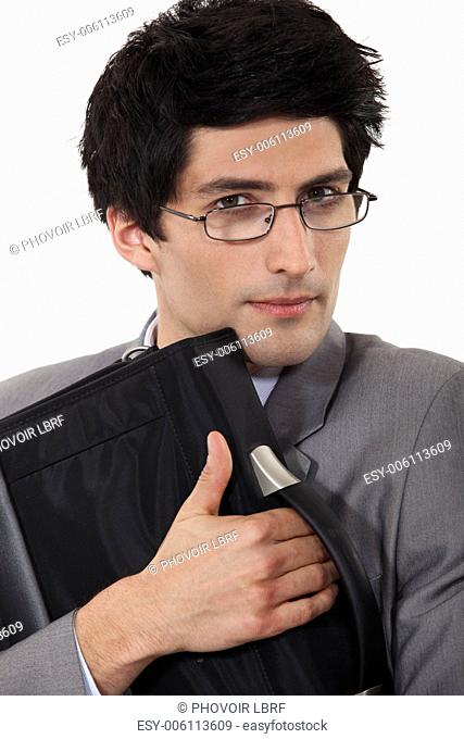 A man holding tight his briefcase
