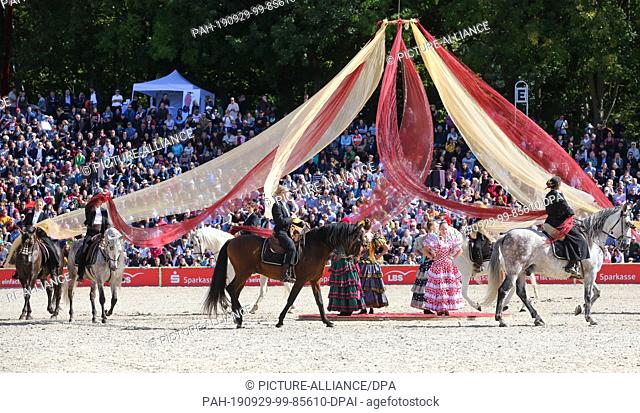29 September 2019, Baden-Wuerttemberg, Gomadingen-Marbach: During the 2019 Stallion Parade, a group of Spanish riders will be on their way to the ""Spain""...