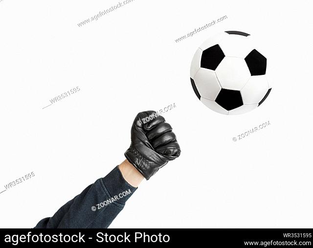 Goalkeeper hand and soccer ball isolated on white background