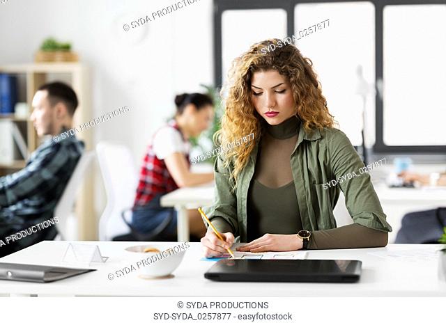 creative woman working on user interface at office