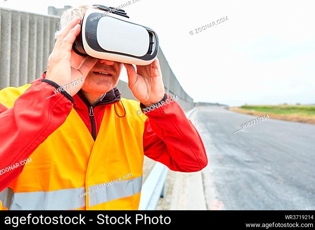 Bauarbeiter mit VR-Brille auf der Baustelle als Simulation für den Straßenbau der Zukunft