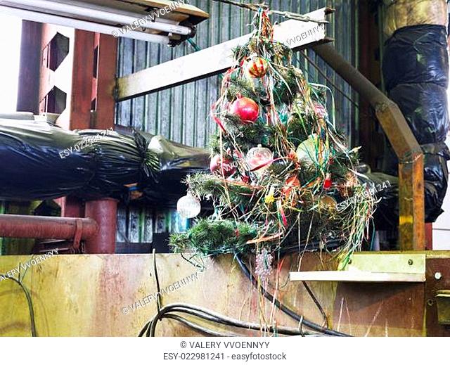 old decorated Christmas tree in workshop