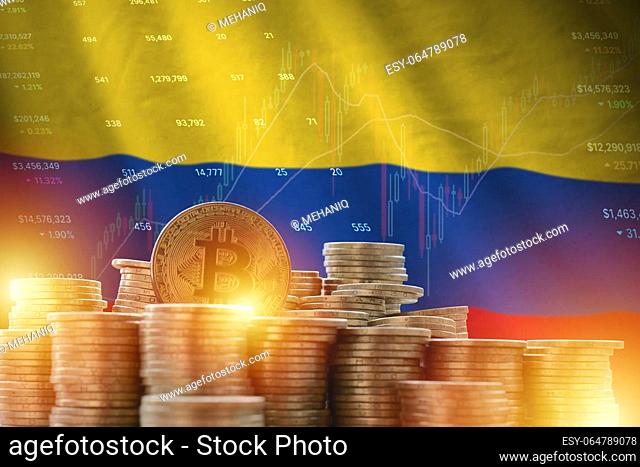 Colombia flag and big amount of golden bitcoin coins and trading platform chart. Crypto currency concept
