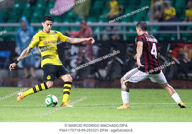 Milan's Jose Mauri (r) and Dortmund's Marc Bartra in action during the international club friendly soccer match between AC Milan and Borussia Dortmund in...