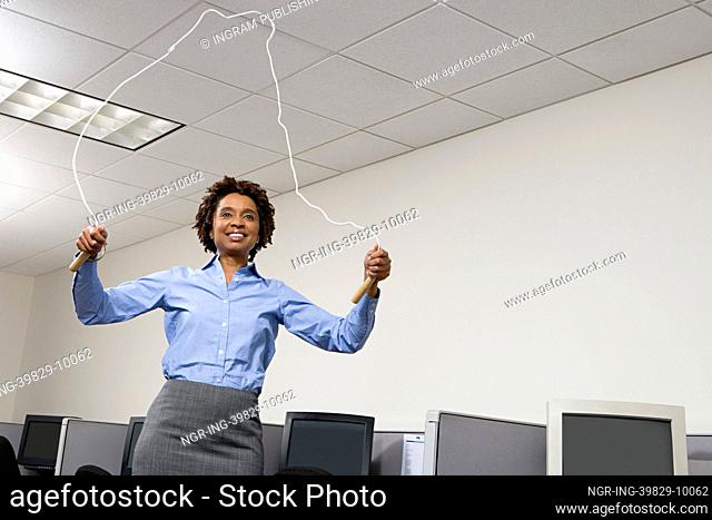Woman skipping in office