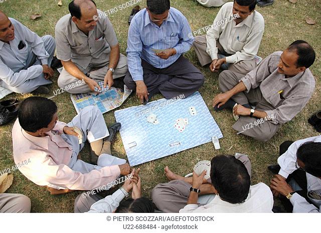 Delhi, India: men playing cards at the Lodi Garden