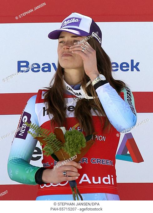 Gold medalist Tina Maze of Slovenia celebrates during the flower ceremony after winning the Ladies' Downhill at the Alpine Skiing World Championships in Vail -...