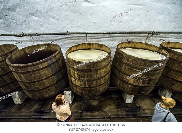 Wooden open fermentation barrels in the historical cellars of Pilsner Urquell Brewery in Pilsen city, Czech Republic