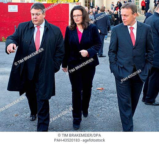 Chairman of the SPD Sigmar Gabriel (L) talks to secretary-general of the SPD Andrea Nahles (C) and Chief Whip of the Bundestag parliamentary group of the SPD...