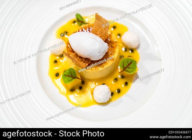 Passionfruit cream brulee on white plate