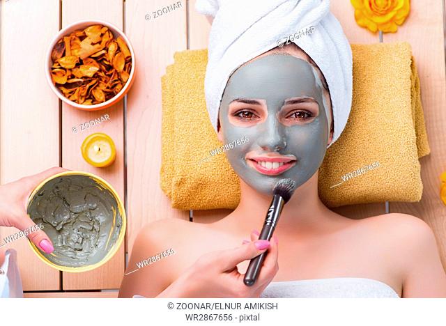 Young woman in spa health concept