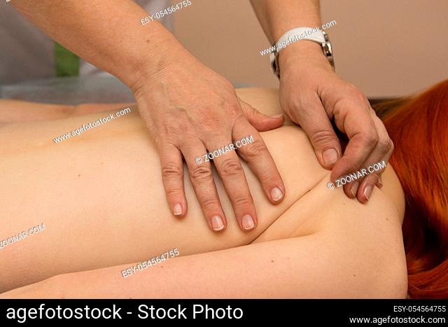 Tired worried man enjoying therapeutic massage