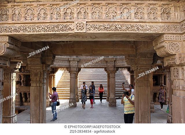View from eastside inside the stepwell, decorated with intricate stone carvings in Adalaj Stepwell, Ahmedabad, Gujarat, India