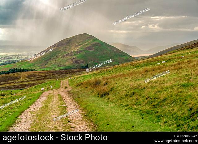 North Pennines landscape, looking at the rain clouds over Dufton Pike in Cumbria, England, UK