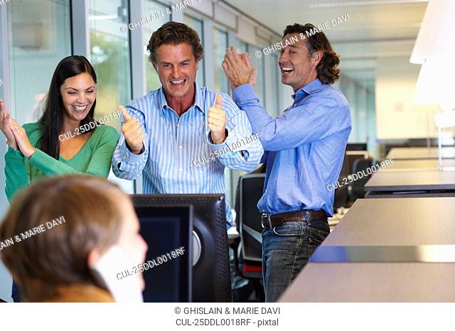 Business team closing a deal, happy