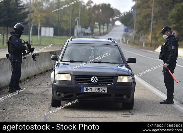Police officers check a car at the borders between Czech Republic and Austria in Breclav-Reinthal, Czech Republic, November 3, 2020