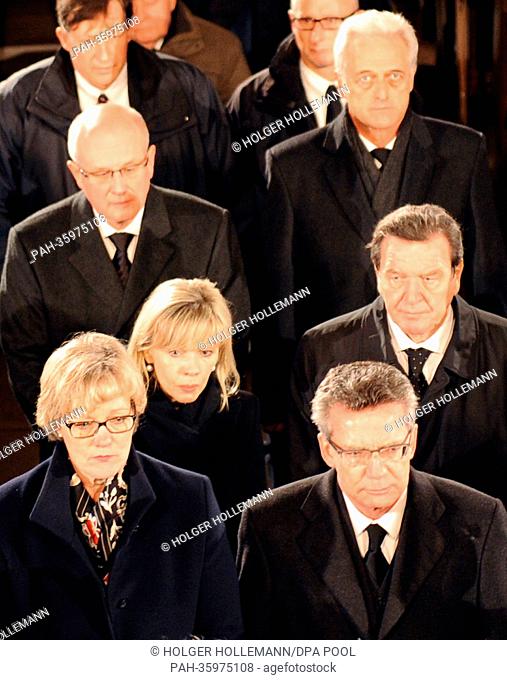 German Defence Minister Thomas de Maiziere, his wife Martina (front L-R), former chancellor Gerhard Schroeder, his wife Doris Schroeder-Koepf