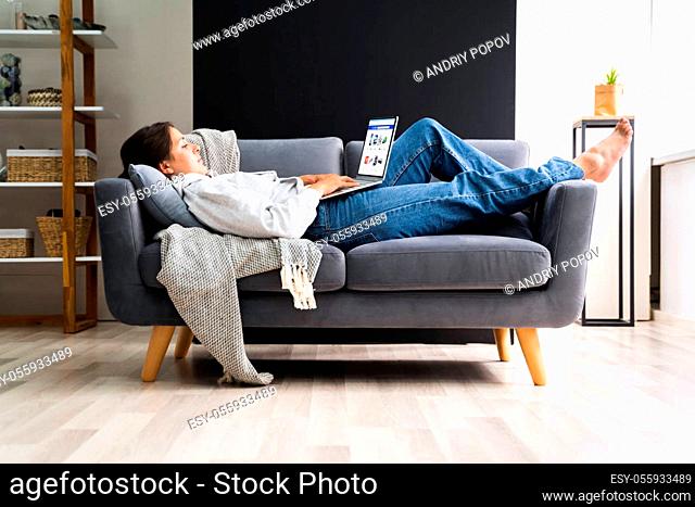 Women Using Computer Laptop On Couch Or Sofa