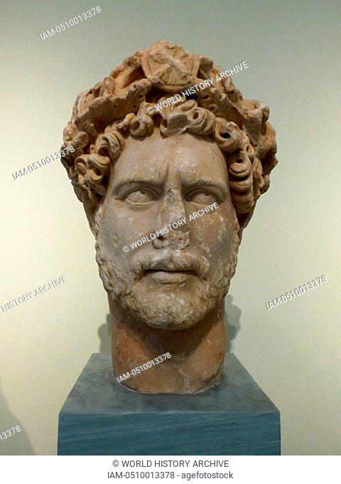 Colossal portrait head of the emperor Hadrian (AD 117-138). Pentelic marble. Found in Athens. The emperor wears a wreath of oak leaves that end above his...