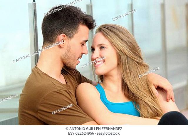 Couple in love looking each other outdoor