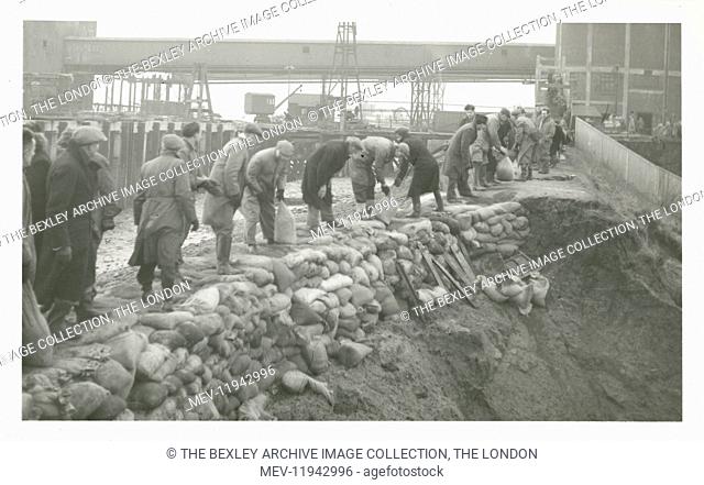 View of the men sandbagging the river bank between Callenders and the Oil Works at Erith during the flooding of February 1953