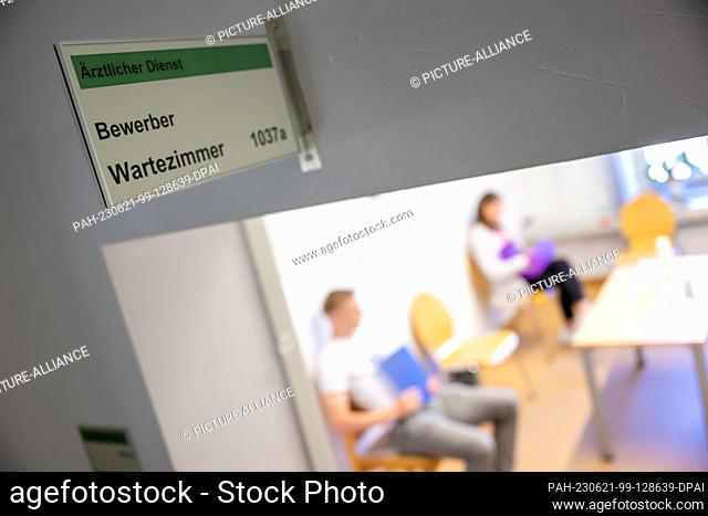 PRODUCTION - 12 June 2023, Bavaria, Munich: Candidates for the intermediate service in the Bavarian Police await their examination at the medical service