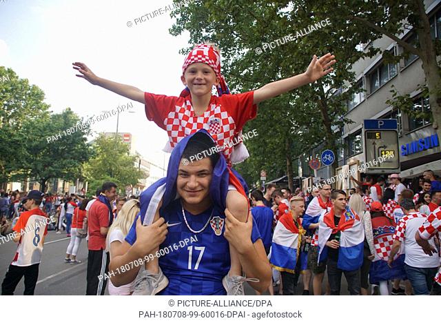 7 July 2018, Stuttgart, Germany - Soccer World Cup, Quarterfinal, Russia vs. Croatia: Fans of Croatia cheer on their team on Theodor Heuss Street