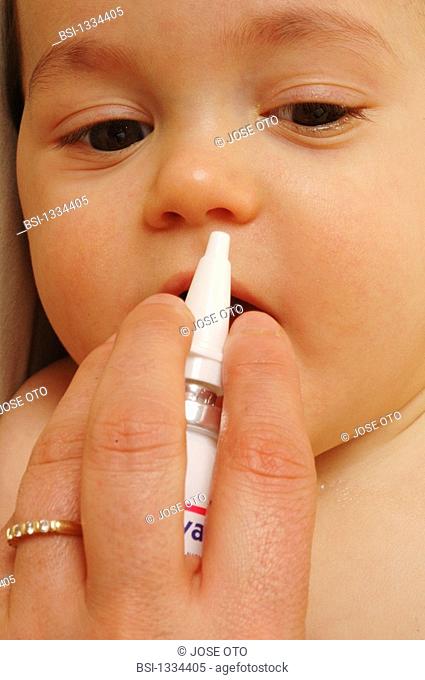 CHILD USING NOSE SPRAY<BR>Model.<BR>8-month-old baby boy