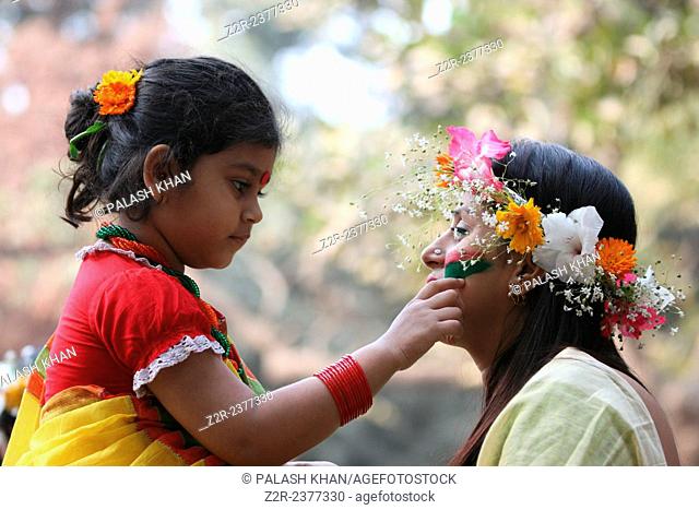 Dhaka 15 February 2015. Young Bangladeshi women decorate themselves with flowers during the ‘Basanto Utsav’ the first day of spring at Dhaka University Fine...
