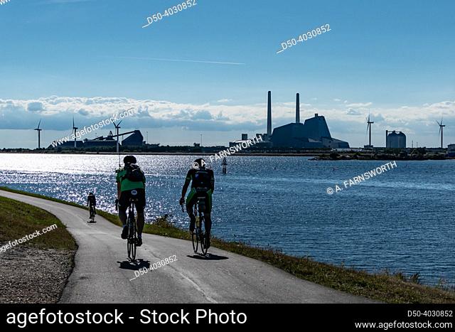 Copenhagen, Denmark Bicyclists near the Avedore Power Station on a bike path
