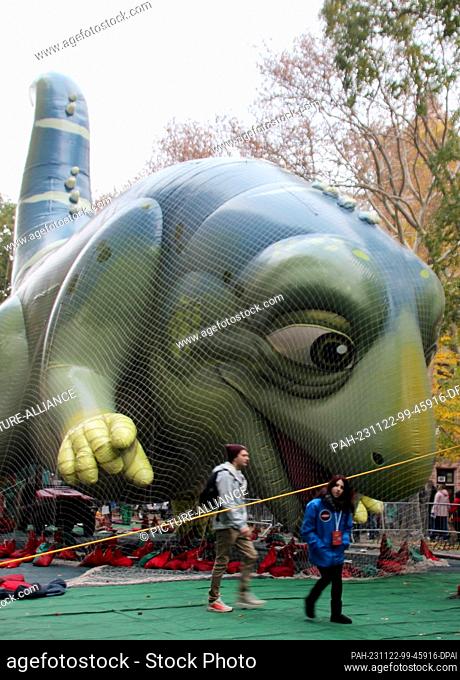 22 November 2023, USA, New York: A giant helium balloon is prepared for the annual Thanksgiving parade in Central Park in Manhattan during the traditional...